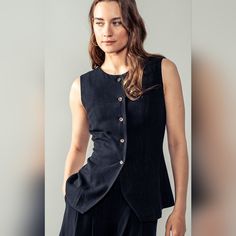 Crafted With Lightweight Linen, This Black Sleeveless Vest Features A Button-Down Front For A Versatile And Stylish Addition To Any Wardrobe. Its Timeless Design And Breathable Fabric Make It A Must-Have For Any Fashion-Forward Individual. Pair With Your Favorite Top And Jeans For A Chic And Put-Together Look. Fabric: 70% Rayon, 30% Linen Lined: Fully Lined Measurement (Inches) Small: Chest 34,Body Length 24 Medium: Chest 36, Body Length 25 Large: Chest 38, Body Length 26 Vest And Shorts Are Sol Sleeveless Button Up, Buttoned Sleeveless Tank Top For Work, Sleeveless Buttoned Tank Top For Work, Summer Denim Vest With Buttons For Workwear, Sleeveless Buttoned Tops For Work, Chic Sleeveless Denim Vest For Work, Fitted Sleeveless Top With Buttons, Sleeveless Workwear Vest With Buttons, Sleeveless Tops For Layering With Button Closure