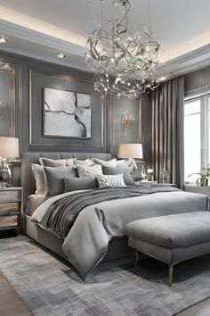 a bedroom with a large bed and chandelier