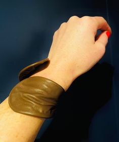 The perfect wrist accessory! 8"x 3" reclaimed leather cuff,wraps to be worn with fold in front or back. Fits to any wrist size!Current Colours: Hot Pink, Cherry Red, Cognac, Espresso, Wine, Onyx, Violet, Snake print Blk, Olive, Snake print Ecru, python print.Made to order Adjustable Brown Leather Bracelet For Party, Elegant Brown Cuff Leather Bracelet, Adjustable Cuff Leather Bracelet, Brown Cuff Bracelets As Fashion Accessory, Brown Cuff Bracelet As Fashion Accessory, Adjustable Leather Cuff Bracelet For Party, Trendy Brown Cuff Bracelet, Brown Cuff Leather Bracelet, Brown Leather Cuff Bracelet With Wrist Strap