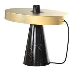 a black and gold table lamp on a white background with a cord connected to it