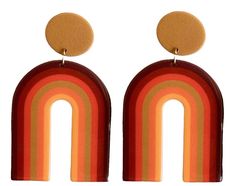 Step back in time to the funky 70s with these 70s Brown Groovy Rainbow Earrings. These earrings capture the essence of the era with their groovy rainbow design in shades of brown. Made from super lightweight acrylic, these earrings offer comfortable and effortless wear all day long. The posts are made of stainless steel coated in 18k gold, providing a luxurious look and ensuring they are nickel-free for sensitive ears. Product Details: Design: The 70s Brown Groovy Rainbow Earrings bring a burst of retro charm to your jewelry collection. With their playful rainbow design in various shades of brown, these earrings exude a groovy vibe that perfectly embodies the spirit of the 70s. Whether you're attending a themed party or want to add a touch of nostalgia to your everyday style, these earring Gold Seventies Inspired Jewelry, 70s Accessories Jewelry Hippie, Cheap Orange Retro Earrings, Retro Rainbow Earrings For Gift, 70s Accessories Jewelry, 70s Accessories, 70s Earrings, Groovy Rainbow, 70s Jewelry