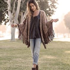 Faux Fur Chalet Grande Poncho Brown Fringe One Size Poncho, One Size Brown Fringe Poncho, Brown One Size Poncho With Fringe, Casual Brown Poncho For Festival, Chic Shawl Cape For Fall, Fall Festival Poncho With Tassels, Bohemian Brown Cape Outerwear, Brown Bohemian Cape Outerwear, Brown Fringe Poncho For Fall