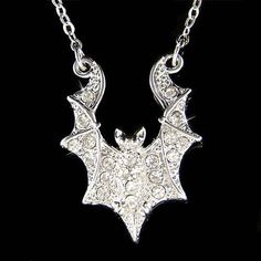 "PERFECT CHRISTMAS GIFT FOR LADIES This is a Brand New, stunning Bat Pendant with Swarovski crystals. It comes with a FREE 16\" with a 2\" extension chain (42cm -47cm) rhodium finish necklace with lobster clasp. Pendant Size: 3/4\" wide X 1\" high (19mm X 25mm) Crystal Color: Crystal Clear Prices are in US$. For shipping policies and other important information, click on \"profile\" on the right. See an item that you like but has already been sold? Contact me to see if I have more! Thank you for Adjustable Chain Jewelry For Halloween Party, Halloween Party Jewelry With Adjustable Chain, Vampire Style Halloween Necklace For Jewelry Making, Halloween Party Pendant Jewelry, Silver Fantasy Necklace For Halloween, Novelty Halloween Party Necklaces, Halloween Party Jewelry With Chain Detail, Halloween Party Jewelry With Chain, Thushi Necklace