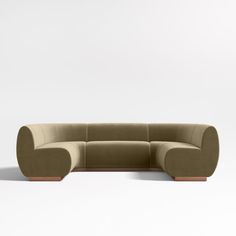 a large sectional couch sitting on top of a white floor