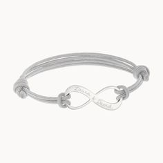 Our versatile Men's Personalized Infinity Bracelet with sliding knot fastening can be personalized with a hand-engraved message and choice braid color.925 Sterling SilverInfinity charm: 1” x 0.4”Braid made of durable, colorfast polyesterSize: between 8-9, fully adjustable sliding knot fasteningEngraved by hand in our Paris workshopSent with love in a complimentary gift boxAny slight variations in lettering depth, spacing and alignment from the examples shown are part of the aesthetic and origina Personalized Silver Braided Bracelet Minimalist Style, Personalized Silver Braided Minimalist Bracelet, Adjustable Infinity Friendship Bracelets, Personalized Silver Braided Bracelets For Friendship, Adjustable Engraved Braided Friendship Bracelets, Father's Day Adjustable Engraved Braided Bracelets, Adjustable Engraved Braided Bracelet For Friendship, Father's Day Engraved Adjustable Braided Bracelets, Father's Day Engraved Adjustable Braided Bracelet