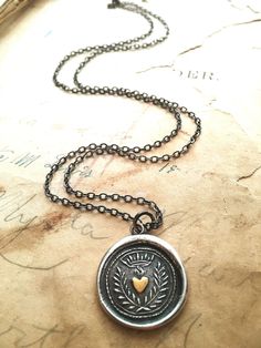 "This Flaming Heart wax seal necklace is the perfect gift for her, handmade using a vintage seal (circa 1700's) that we acquired in England from an antiquities shop with the story that is once belonged to a man in King Georges' court. This man was responsible for the King's correspondence. The crown signifies nobility while the flaming heart signifies love and undying affection. We've made it extra special by making the heart 22kt gold, the perfect sentiment for a romantic gift, anniversary, bir Heirloom Necklace With Vintage Charm For Valentine's Day, Elegant Vintage Jewelry For Valentine's Day, Vintage Medallion Necklace For Anniversary, Vintage Charm Medallion Necklace For Anniversary, Vintage Medallion Necklace For Anniversary Gift, Vintage Charm Medallion Necklace For Anniversary Gift, Vintage Sterling Silver Necklace For Mother's Day, Elegant Stamped Necklaces For Anniversary Gift, Elegant Stamped Necklace For Anniversary Gift