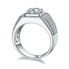 a white gold ring with diamonds on the sides and a center stone in the middle