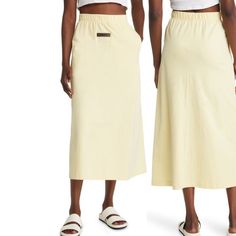 Canary Yellow Midi Skirt With Pockets And Logo Casual Daywear Midi Skirt, Casual Midi Skirt For Daywear, Casual Pencil Skirt For Daywear, Yellow Midi Skirt, Midi Skirt With Pockets, Mid Skirt, Cotton Midi Skirt, Fear Of God Essentials, Canary Yellow