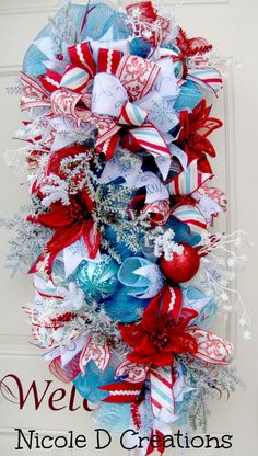 a patriotic wreath with red, white and blue decorations