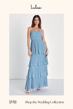 a woman in a blue dress with the words shop the wedding collection