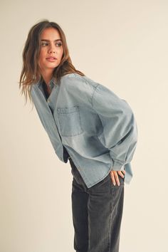 Elevate your spring wardrobe with the Nina Denim Shirt! This must-have piece combines nostalgia with modern trends, making it a versatile and stylish choice. Whether paired with denim or a leather skirt, the Nina shirt is sure to make a statement. Get ready to turn heads with this spring 2024 fashion essential! Denim Button Down Shirt, 90s Denim, Denim Chic, Modern Trend, Denim Button Down, 2024 Fashion, Spring Wardrobe, Romper With Skirt, Spring 2024