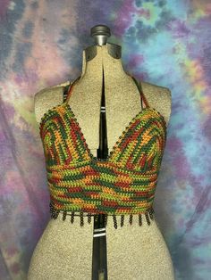 Handmade crochet halter top with intricate beading  Size M/L Perfect for festivals, raves or everyday wear Machine washable, air dry to protect beading  Will stretch a little upon wear  Made with love Bohemian Stretch Crop Top With Triangle Shape, Bohemian Stretch Triangle Crop Top, Bohemian Triangle Halter Top With Stretch, Bohemian Stretch Triangle Halter Top, Multicolor Triangle Top For Festival, Bohemian Multicolor Halter Neck Crop Top, Multicolor Sleeveless Hippie Crop Top, Multicolor Halter Neck Top For Festivals, Multicolor Halter Neck Crop Top For Festival