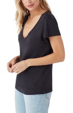 Achieve a casual-cool vibe in this soft cotton-modal T-shirt designed with a dipped neckline and abbreviated sleeves. 25 1/2" length (size Medium) V-neck Short sleeves 52% cotton, 48% modal Machine wash, line dry Imported Women's Clothing Casual V-neck T-shirt For Gatherings, Relaxed Fit V-neck T-shirt For Casual Gatherings, Stretch Modal T-shirt For Summer, Chic Cotton T-shirt For Layering, Chic Cotton T-shirt For Casual Gatherings, Cotton V-neck T-shirt For Layering, Black V-neck T-shirt For Everyday, Chic V-neck T-shirt For Fall, Chic Fall V-neck T-shirt