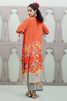 Orange asymmetric kurta with floral garden patterns and placement sequin embroidery. Comes with pant.
Components: 2
Pattern: Embroidered
Type Of Work: Floral, Sequin
Neckline: Round
Sleeve Type: Three quarter
Fabric: Crepe
Color: Orange
Other Details: 
Pintucked placket
Model Height: 5ft 10inches wearing size S
Weight: 800 grms
Occasion: Sangeet,Mehendi and Haldi - Aza Fashions Festive Spring Sets With Printed Motifs, Spring Palazzo Set With Straight Kurta And Printed Motifs, Spring Palazzo Set With Printed Motifs And Straight Kurta, Spring Pant Set With Straight Kurta And Printed Motifs, Summer Anarkali Sets With Digital Print, Spring Pant Set With Printed Motifs And Straight Kurta, Spring Designer Sets With Printed Motifs, Designer Spring Sets With Printed Motifs, Silk Maxi Sets For Spring