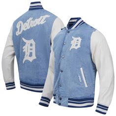 Get that classic gameday look with this Detroit Tigers Varsity Blues Full-Snap Varsity Jacket from Pro Standard Denim. This stylish varsity jacket features a classic denim design with rib-knit striping and multiple heat-sealed Detroit Tigers patches for a bold display of team pride. With its moderate weight and comfortable cotton-polyester blend, it's the perfect jacket for a cool evening at the ballpark or a casual outing in the city. Varsity Jacket With Button Closure For College, White College Style Outerwear For Game Day, White Varsity Jacket With Button Closure, Sporty Varsity Jacket For College With Button Closure, Blue Sporty Outerwear For Game Day, Casual Long Sleeve Denim Jacket For College, Collegiate Outerwear For Baseball Season Game Day, Collegiate Track Jacket For Game Day, Collegiate Style Track Jacket For Game Day