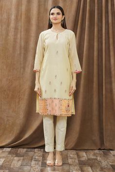 Beige kurta with placement embroidered motifs and contrast panel at the hem. Comes with straight pants and dupatta.
Components:3
Pattern:Embroidery
Type of Work:Thread, Beads and Sequin
Neckline:Round
Sleeve Length:Three Quarter
Fabric:Chanderi and Georgette
Color:Beige
Other Details:
Dupatta with embroidery and contrast panel
Side slits
Keyhole front with loop button
Occasion:Puja - Aza Fashions Beige Kurta, Thread Beads, Kurta Pant Set, Embroidered Motifs, Pattern Embroidery, Kurta With Pants, Pant Set, Straight Pants, Set For Women