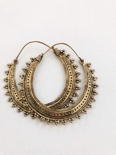 "Beautiful etched brass hoops on brass ear wire. DETAILS: Brass Hoops Size: 2.5\"L x2\" W Can be worn daily, brass will require occasional polishing. Ships with sample polishing cloth. *Packaged for gift giving. *Sold individually. Return to shop: Afrohemien.etsy.com Like and Follow Afrohemien for updates, sales, coupons and surprise giveaways Instagram/Blog: instagram.com/Afrohemien Tumblr: Afrohemien.tumblr.com Facebook: www.facebook.com/Afrohemien Twitter: twitter.com/Afrohemien" Bohemian Round Brass Hoop Earrings, Bohemian Bronze Hoop Earrings In Brass, Brass Hoop Jewelry For Festivals, Bohemian Bronze Brass Hoop Earrings, Gold Small Hoop Plug Earrings In Brass, Bohemian Bronze Nickel-free Hoop Earrings, Festival Brass Hoop Jewelry, Bohemian Antique Gold Brass Earrings, Brass Small Hoop Earrings For Festival