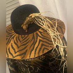 All My Hats That You Will See Ste All One Of A Kind Designed By Me I Call This One Jungle Fever.. It Has A Beautiful Crystal. Zebra Head On It With Feathers Leaves And Trimmed With Pom-Poms. The New Hat Is By Jessica Simpson And Then I Added My Magic The Cover-Up Is Beautiful. It’s Sheer One Size Fits All. Fit Up To An Extra Large.. Has Beading On The Yoke Really Pretty There Is Straw Raffia Trim. . And Fun. All The Hats That You Will Be Seeing Are One Of A Kind Just Like Me? Fitted Brown Sun Hat For Vacation, Summer Party Straw Hat, Black Hat For Beach Season Sunbathing, Black Summer Straw Hat For Sunbathing, Black Hat For Sunbathing During Beach Season, Beach Season Fedora Sun Hat For Parties, Black Straw Hat For Sunbathing During Beach Season, Beach Season Party Fedora Sun Hat, Trendy Black Summer Hat