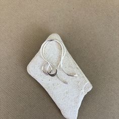 "I made these fancy teardrop earring hooks using 20 gauge .925 sterling silver wire.  I hand formed the ear wires and then gradually hammered the ends and bottom of the teardrop loops to make them more interesting. They are then hand sanded to a smooth finish and tumbled for extra strength and shine. Approximate Measurements: Length: 1\" (26mm) Width: just a little over 1/2\" (14mm) Teardrop Width: 1/4\"  (7mm) These are sold by the pair. If you need more than 20 pairs, please contact me so that arrangement can be made. Please note, I make these earring hooks by hand, there may be some slight variations from pair to pair.  Please Read: All items in my shop are made to order. Make sure you check out my shop announcement for current production times.  Thank you!  If you would like to see mor Modern Teardrop Sterling Silver Wrap Earrings, Modern Sterling Silver Teardrop Wrap Earrings, Nickel-free Long Drop Sterling Silver Earrings, Adjustable Sterling Silver Hoop Earrings With Ear Wire, Minimalist Silver Long Drop Threader Earrings, Elegant Sterling Silver Teardrop Threader Earrings, Everyday Silver Hoop Earrings With French Hook, Silver Sterling Teardrop Wrap Earrings, Silver Teardrop Sterling Silver Wrap Earrings