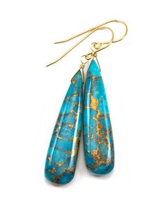 A unique cut of copper blue turquoise in a teardrop shape. Beautiful shades of blue throughout. The french earwires are Sterling Silver or 14k Solid Gold or Filled - you choose. Gemstone size is 10x30mm. The earrings hang 1.7 inches. The mannequin show the relative size and how they will hang. These have a great look when wearing them. Turquoise Teardrop Wire Wrapped Jewelry, Silver Ring Designs, Baroque Pearl Earrings, Wire Wrapped Earrings, Earrings Long, Swarovski Jewelry, Ceramic Jewelry, Unique Gemstones, Fine Earrings