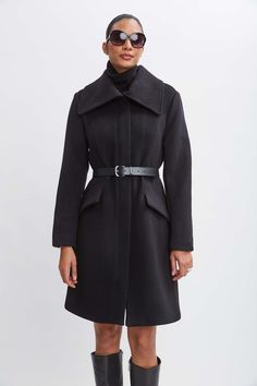 Wrap up this season in our chic belted coat done in a warm double face wool. This sophisticated fully lined coat makes a cold weather statement featuring an oversized collar, contour seams and vegan leather belt; the silhouette is a modern twist on a classic, setting a new standard in outerwear. Elie Tahari Exclusive Panel Wool Coat with Vegan Leather Belt & oversized collar 80% Wool, 15% Nylon, 5% Cashmere Runs true to Size Length From Shoulder to Hem: Back 38.5"L, Sleeve: 33"L (approx. length Chic Belted Wool Coat, Chic Wool Belted Pea Coat, Chic Business Outerwear With Belt Detail, Modern Wool Coat With Lapel Collar For Fall, Chic Belted Pea Coat For Winter, Winter Formal Outerwear With Belt Detail, Elegant Winter Outerwear With Belt Loops, Chic Winter Outerwear With Belt Loops, Formal Winter Outerwear With Belt Detail