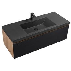 a black sink sitting on top of a wooden counter