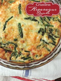 a quiche with cheese and spinach in a glass dish