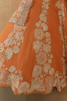 Tangerine lehenga with floral hand embroidered motifs in silk thread work, french knots, glass beads and mirror work. Paired with floral embroidered blouse and dupatta.
Component: 3
Embroidered
Neckline: Round
Sleeve Length: Sleeveless
Fabric: Organza
Color: Orange
Floral motifs
Silk thread work
Embroidered dupatta - Aza Fashions Anarkali Set With Floral Embroidery For Wedding, Anarkali Wedding Set With Floral Embroidery, Organza Anarkali Set With Intricate Embroidery, Traditional Floor-length Anarkali Set With Floral Embroidery, Traditional Floor-length Anarkali With Floral Embroidery, Floral Embroidered Chinon Set For Reception, Semi-stitched Orange Dress With Intricate Embroidery, Floor-length Organza Anarkali Set With Intricate Embroidery, Festival Organza Anarkali Set With Intricate Embroidery