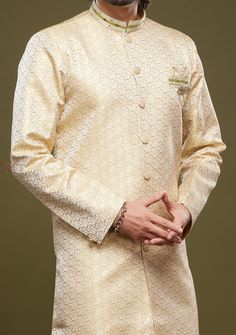 Ready-Made Sherwani With Aligarhi Trouser. All Over Jacquard Brocade Style Fabric Top. Art Silk Aligarhi Ready Made Trouser. Crafted in Chinese Collar Neck, and Full Sleeve. Satin Lining with Plain Work. High-Quality Matching Buttons. Please Note: The footwear shown in the picture is for presentation and photography purpose only. Color: There might be slight color variation due to lightings and flashes while photo shooting. The color may also vary because of different screen resolutions. Wash Ca Semi-stitched Gold Kurta With Naqshi, Traditional Semi-stitched Nehru Jacket For Eid, Gold Lawn Suit With Naqshi In Traditional Drape, Festive Naqshi Churidar, Festive Traditional Wear With Cutdana And Long Sleeves, Wedding Lawn Suit With Cutdana For Diwali, Festive Wedding Lawn Suit With Cutdana, Festive Formal Lawn Suit With Naqshi Details, Ceremonial Kurta With Cutdana For Eid