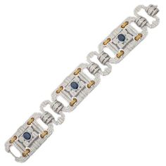 This is part of Chairish’s Fine Jewelry assortment.  This Art Deco Inspired Sapphire Diamond Bracelet in 18K gold showcases 3 endlessly sparkling natural sapphire weighing 6.4 carats with diamonds of 10.5 carats. It measures 7.025 inches long in length.  Sapphire stimulate concentration and reduces stress.  Designed with perfect oval cut sapphire each surrounded with  diamonds making a gorgeous charm which are linked with yellow gold link to make you stand out on any occasion or event. The elegant style complements the attire beautifully and this is a perfect Unique Gift, Bridal Shower Gift, Secret Santa Gift, Gift For Sister, Mother Daughter Gift, Bride To Be Gift, Bridesmaid Gift, Thanksgiving Gift, Anniversary Present, Christmas Gift or any Holiday Gift for Mother, Sister, Daughter, Gra Luxury Blue Diamond Bracelet For Formal Events, Luxury Blue Diamond Bracelet For Formal Occasions, Luxury Sapphire Bracelet, Luxury Sapphire And Diamond Bracelet, Luxury Sapphire Diamond Bracelet With Gemstones, Luxury White Gold Sapphire Diamond Bracelet, Luxury Sapphire Bracelet With Diamond Accents, Luxury Sapphire Bracelets With Diamond Accents, Luxury Sapphire Diamond Bracelet With Accents