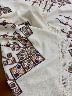 White Bohemian Embroidered Fabric For Festivals, Vintage Embroidered Fabric With Traditional Patterns For Festivals, Vintage Embroidered Fabric For Traditional Ceremonies, Traditional Handmade Multicolor Embroidered Fabric, Traditional Handmade Embroidered Multicolor Fabric, Handmade Traditional Multicolor Embroidered Fabric, Traditional Cream Embroidered Fabric With Motifs, Traditional Embroidered Cream Fabric With Motifs, Bohemian White Embroidered Fabric