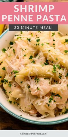 shrimp penne pasta with parmesan cheese in a bowl