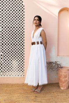 Are you someone who loves white? Then meet the Tulu Dress to fall in love even more! A fit and flare dress with an overlapping neck, smocked details on the waist and back. Oh and for the absolute detail we love- a wooden handcrafted beaded belt for the perfect boho contrast to an otherwise white summer staple. Scalloped edges dramatically add to the entire look. The model is wearing size S. 🌸 〰️〰️〰️ 🌸 〰️〰️〰️ 🌸 Care and Composition100% Cotton.Dry clean/Hand wash in cold water. Mild liquid dete Beaded Belt, Scalloped Edges, Summer Staples, Clean Hands, White Summer, Fit And Flare Dress, Dresses Xs, Flare Dress, Fit And Flare