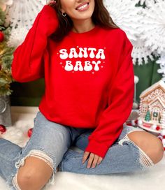 Embroidered Santa Baby Sweatshirt, Christmas Sweatshirt, Embroidery Christmas Sweatshirt, Christmas Shirt, Santa Baby Shirt UNISEX GILDAN 18000 SWEATSHIRT Features: * Unisex sizing * 50% cotton, 50% polyester * Relaxed fit * Pre-shrunk medium weight fabric * Air-jet spun yarn with a soft feel and reduced pilling * Double-needle stitched collar, shoulders, armholes, cuffs, and hem Want the trendy oversized dress look? Order 1- 2 sizes larger than your usual size. Easy measuring tip: Take your fav Gift Red Embroidered Top, Red Embroidered Holiday Tops, Red Embroidered Tops Gift, Red Embroidered Top For Gift, Christmas Long Sleeve Sweatshirt With Embroidered Text, Red Embroidered Tops As Gift, Baby Sweats, Baby Santa, Sweatshirt Embroidery