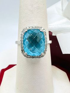 14K White Gold Blue Topaz & Diamond 0.35ct Ring Size 7.25 A perfect gift for your loved one for any special occasion or holiday! Total Ring Weight: 3.89g Ring Length: 28.26mm Ring Width: 20.18mm Gemstone: Diamond Total Diamond: 0.35ct Item will be placed into a gift box. * Blue Diamond Ring With Accents For Anniversary, Blue Round Cut Gemstones For Anniversary, Dazzling Blue Diamond Gemstones, Blue Oval Diamond Ring With Vs Clarity, Oval Blue Diamond Ring With Vs Clarity, Turquoise Diamond Ring Fine Jewelry Gift, Turquoise Diamond Anniversary Ring, Blue Diamond Fine Jewelry, Fine Jewelry Turquoise Diamond Ring As Gift