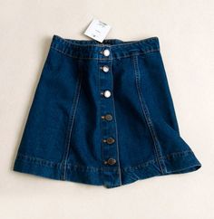 Haven't got the latest button-down denim skirt yet? Swap your boring mini skirts with this on-trend piece!This denim skirt featuring a button-down detail is one of the most popular trend RN in 2016. The A-line and high-waisted details can help elongate your legs and make your waist looks smaller. Style this minis with turtleneck top and wedges for that retro 60's vibes! Not comfortable in flashing.. Summer Cotton Denim Skirt With Button Closure, Spring Denim Skirt With Button Closure, Denim Skirt With Button Closure For Fall, Fall Denim Skirt With Button Closure, Fall Denim Skirt With Buttons, Summer Denim Skirt With Button Closure, Medium Wash Skirt With Button Closure For Spring, Spring Medium Wash Skirt With Button Closure, Trendy Spring Denim Skirt With Button Closure