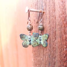 "I hand patina these beautiful metal butterfly to create a green verdigris coloring. The green verdigris patina has been sealed with lacquer to insure a very durable finish. A simple 5mm antique brass filigree ball sit a top the sweet butterflies. They measure 1 ½\" from the top of the antique brass earrwires. The butterflies measure ¾\" in width. See more of my jewelry designs here: https://www.etsy.com/shop/JensBeadBox All my jewelry comes gift boxed with a bow ready for gift giving whether it Unique Green Butterfly Earrings, Green Adjustable Jewelry With Butterfly Charm, Green Bohemian Butterfly Jewelry, Bohemian Green Butterfly Jewelry, Nature-inspired Green Butterfly Jewelry, Green Butterfly Nature-inspired Jewelry, Pierced Green Copper Earrings, Green Copper Pierced Earrings, Vintage Green Patina Earrings