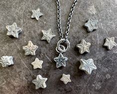 "A sweet tiny textured star fossil necklace pendant ... a crinoid star fossil ... endlessly interesting historic fossil jewelry. They're also called sea lily fossils and date back up to 201 million years ago, perhaps even earlier and believe it or not they are very common fossils if you look in the right places.  They were sea animals, like sea stars and sea urchins.  You've probably seen them in Victorian imagery - 5th photo.   We are all of us stars, and we deserve to twinkle ... Marilyn Monro Sea Urchin Jewelry, Sea Lily, Fossil Necklace, Crinoid Fossil, Wax Seal Pendant, Fossil Earrings, Sea Stars, Sea Urchins, Sea Jewelry