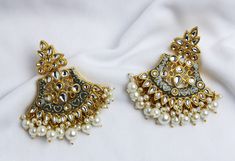 Fancy Party Wear Traditional Earrings. Perfect with ethnic & traditional wear. Perfect gift for any occasion for yourself and your dear ones. It is advisable to store jewellery in a zip lock pouch (air tight pouch), keep away from water perfume and other chemicals and clean it with dry and soft cloth. Wedding Chandbalis With Matching Earrings For Navratri, Traditional Pearl Earrings For Festive Celebrations, Traditional Pearl Earrings For Celebration, Traditional Pearl Earrings With Stone Work For Festive Season, Traditional Chandbali Pearl Earrings For Party, Festive Traditional Pearl Earrings With Meenakari, Traditional Meenakari Pearl Earrings For Festive Occasions, Traditional Festive Pearl Earrings With Stone Work, Traditional Meenakari Pearl Earrings For Party