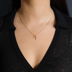 Two beautiful gold cross pendants hang from this delicate chain, giving it a little more flair than a traditional single cross necklace. It's an ideal gift for anyone who's about to celebrate a wedding, a confirmation or a First Communion. Made from high quality materials to last for years to come. Materials: 14K gold plated brass Features: Measures 16" with 2" extender, 10-14mm charms, Lead & Nickel free, lobster clasp Gold Plated Cross Necklace With Delicate Chain, Yellow Gold Charm Necklace With Cross Pendant, Yellow Gold Cross Pendant Charm Necklace With Delicate Chain, Yellow Gold Cross Charm Necklace With Adjustable Chain, Elegant Cross Charm Necklace With Adjustable Chain, Yellow Gold Cross Charm Necklace With Delicate Chain, Gold Crucifix Charm Necklace In Minimalist Style, Gold Minimalist Crucifix Charm Necklace, Delicate Yellow Gold Cross Charm Necklace