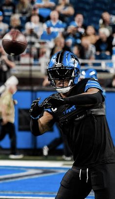 a football player throwing a ball in the air