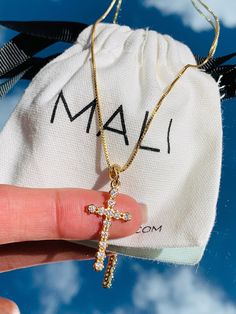 Our latest addition to our Dainty Cross Necklaces! Flaunt your faith or gift the perfect protection cross necklace. A dainty gold filled Chain adorned with Cubic Zirconias. Our religious pieces make a great gift for any Communion, Baptism/ Christening or Confirmation.  The chain is available in kids and adults for matching Mommy and/or Daddy and me. You item will be beautifully packaged ready for gifting.  Charm Slides easily slides off allowing for a more versatile use of the chain. Think two l Spiritual Tarnish-resistant Cross Necklace As Gift, Cross Necklace With Adjustable Chain Crucifix As Gift, Crucifix Cross Necklace With Adjustable Chain, Crucifix Cross Necklace With Adjustable Chain As Gift, Spiritual Cross Necklace With Adjustable Chain As Gift, Everyday Spiritual Cross Pendant Necklace, Communion Gifts Girl, Dainty Cross Necklace, Diamond Cross Necklace