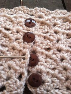 there is a crochet pattern with buttons on it