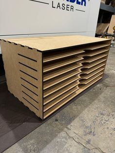 a large stack of cardboard boxes sitting on top of a floor