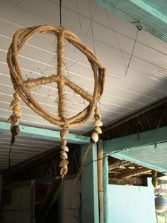 a wooden peace sign hanging from the ceiling