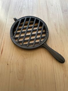 a cast iron skillet sitting on top of a wooden table