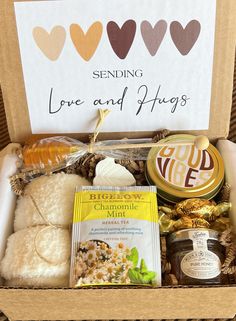 a box filled with lots of different types of food and snacks on top of a table