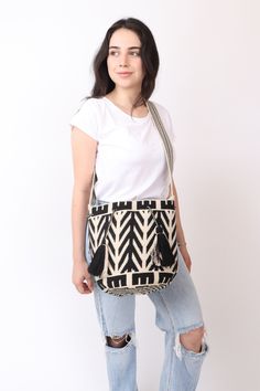 a Premium Quality Beige & Black Wayuu Purse handwoven in Crochet  By Women From the Wayuu Tribe in Colombia. This Beautiful 2 Thread Bag comed with a Long strap suitable for both Shoulder & Crossbody . - Sturdy & Wide enough to hold all your items and Accesories . Each Bag Takes up to 9 Days To Weave & they are a true Work of Art. Size : 27x23cm (Large) Strap : 110cm (crossbody) [41in] crochet purse , woven bag , woven wayuu purse. - 🌟Shipping: DHL : * USA, Central & North America: 2-3 Business Black Woven Crossbody Shoulder Bag, Casual Handwoven Crossbody Bucket Bag, Casual Handwoven Crossbody Crochet Bag, Casual Handwoven Crossbody Shoulder Bag, Casual Handwoven Crochet Crossbody Bag, Black Woven Crossbody Bucket Bag, Casual Woven Shoulder Bag For Everyday Use, Casual Weaving Shoulder Bag For Everyday Use, Black Handwoven Shoulder Bag