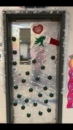 a door decorated with christmas decorations and candy