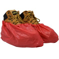 two pairs of shoes sitting in a red bag on top of a white background with the shoe cover over them